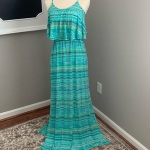 Teal maxi dress, cute detailing. Stretchy fabric very flattering. Side slit
